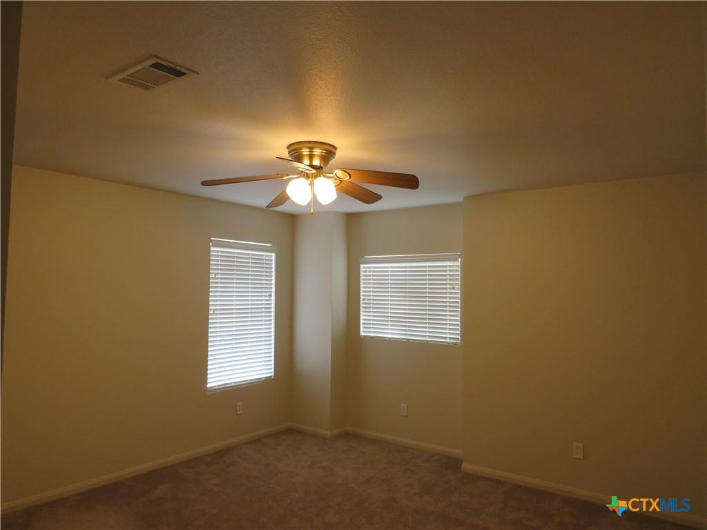 3607 Starfish Drive Killeen, TX 76549 - Photo 12 of 16 a view of a livingroom with a chandelier fan and a window