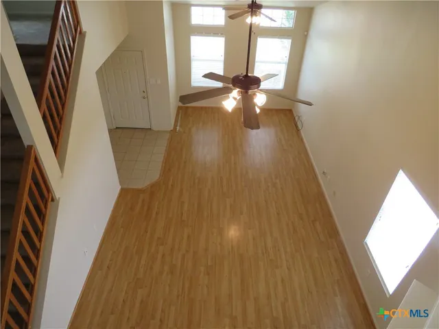 a view of an entryway with wooden floor
