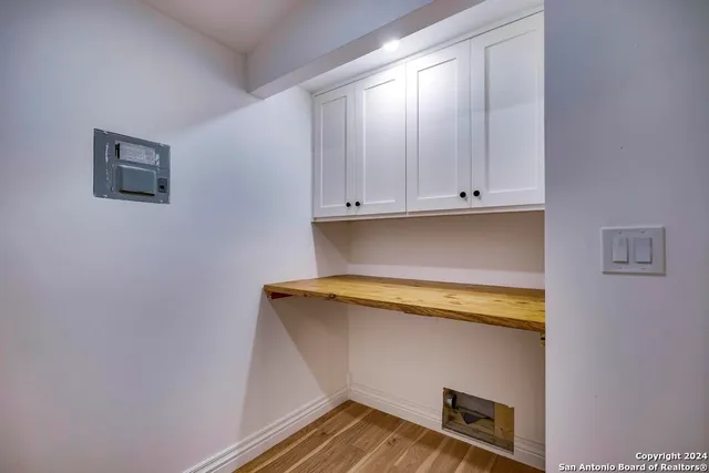 a bathroom with a sink vanity toilet and shower