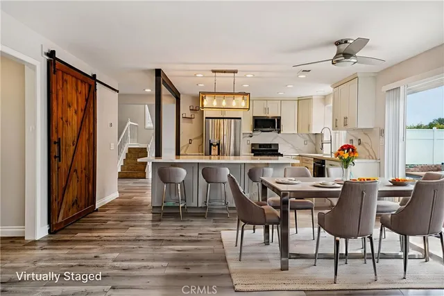 a view of a dining room with furniture and a window