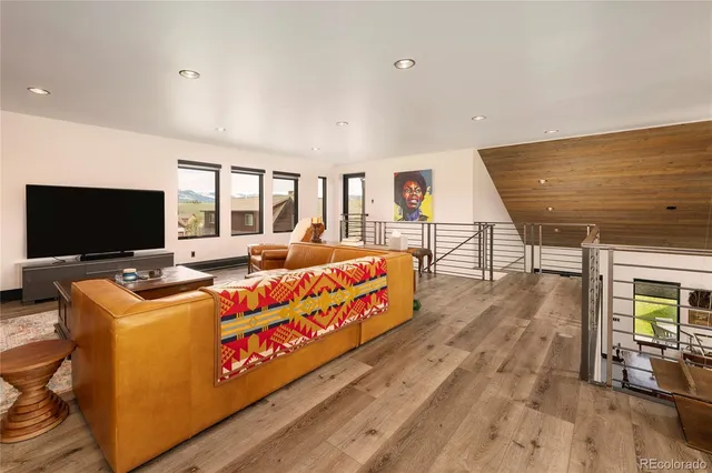 a view of walk in closet with clothes