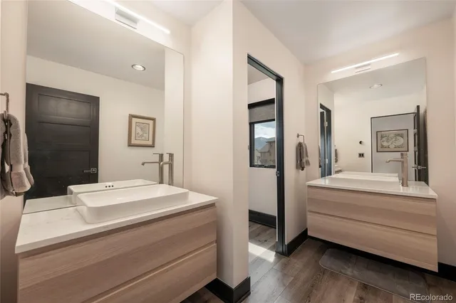 a living room with fireplace furniture and a large window