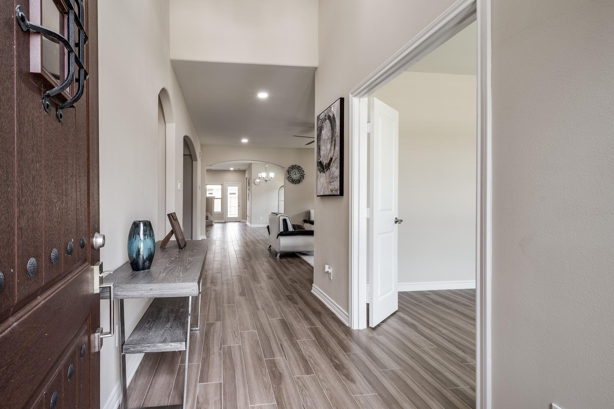 10610 Ellerston Road Cleveland, TX 77327 - Photo 2 of 26 a very nice looking room with wooden floor and a bathroom