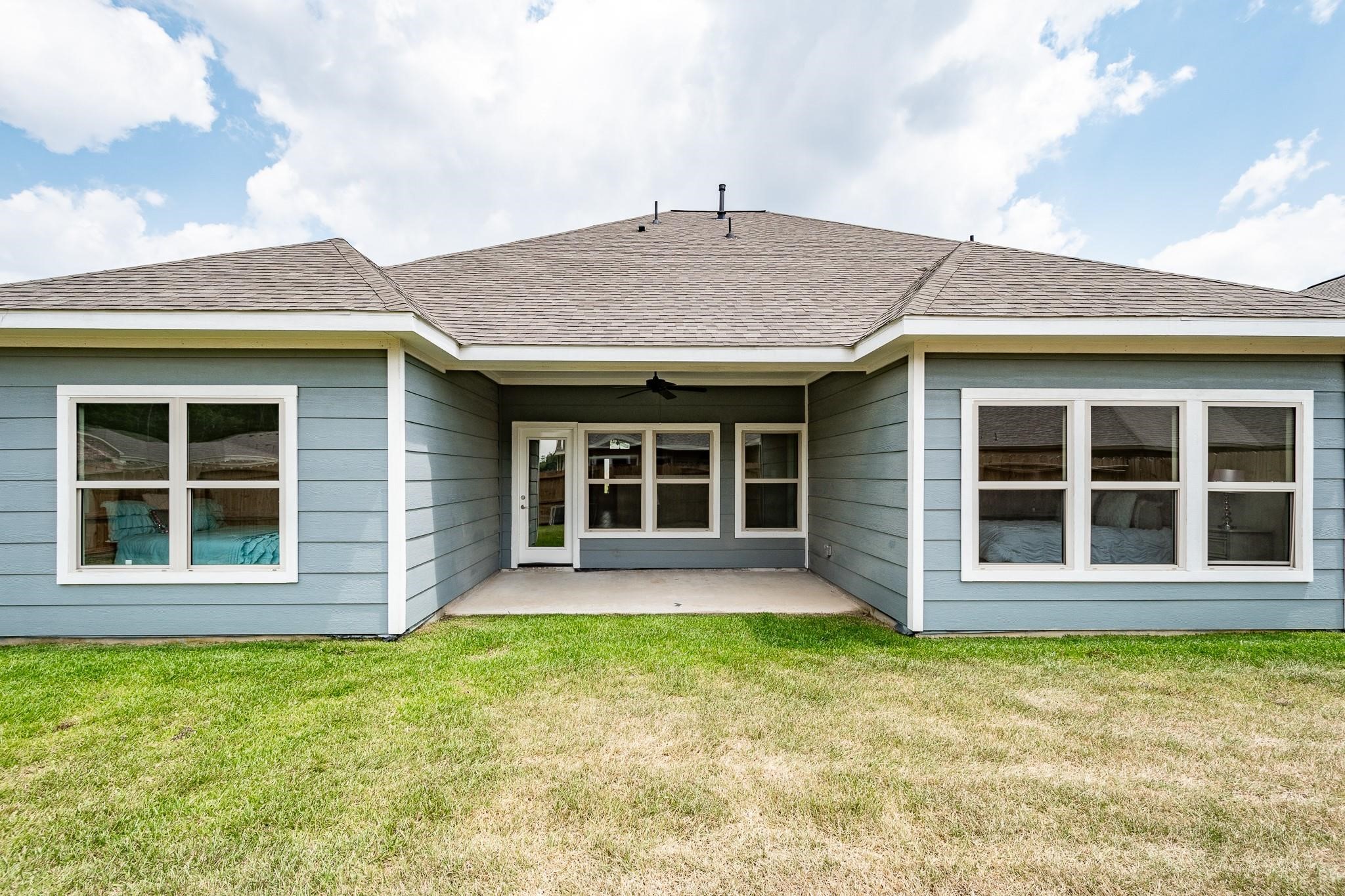 10610 Ellerston Road Cleveland, TX 77327 - Photo 25 of 26 a view of a house with a garden