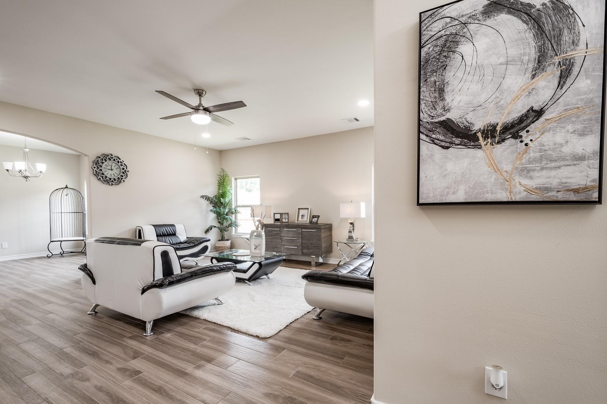 10610 Ellerston Road Cleveland, TX 77327 - Photo 3 of 26 a living room with furniture and wooden floor