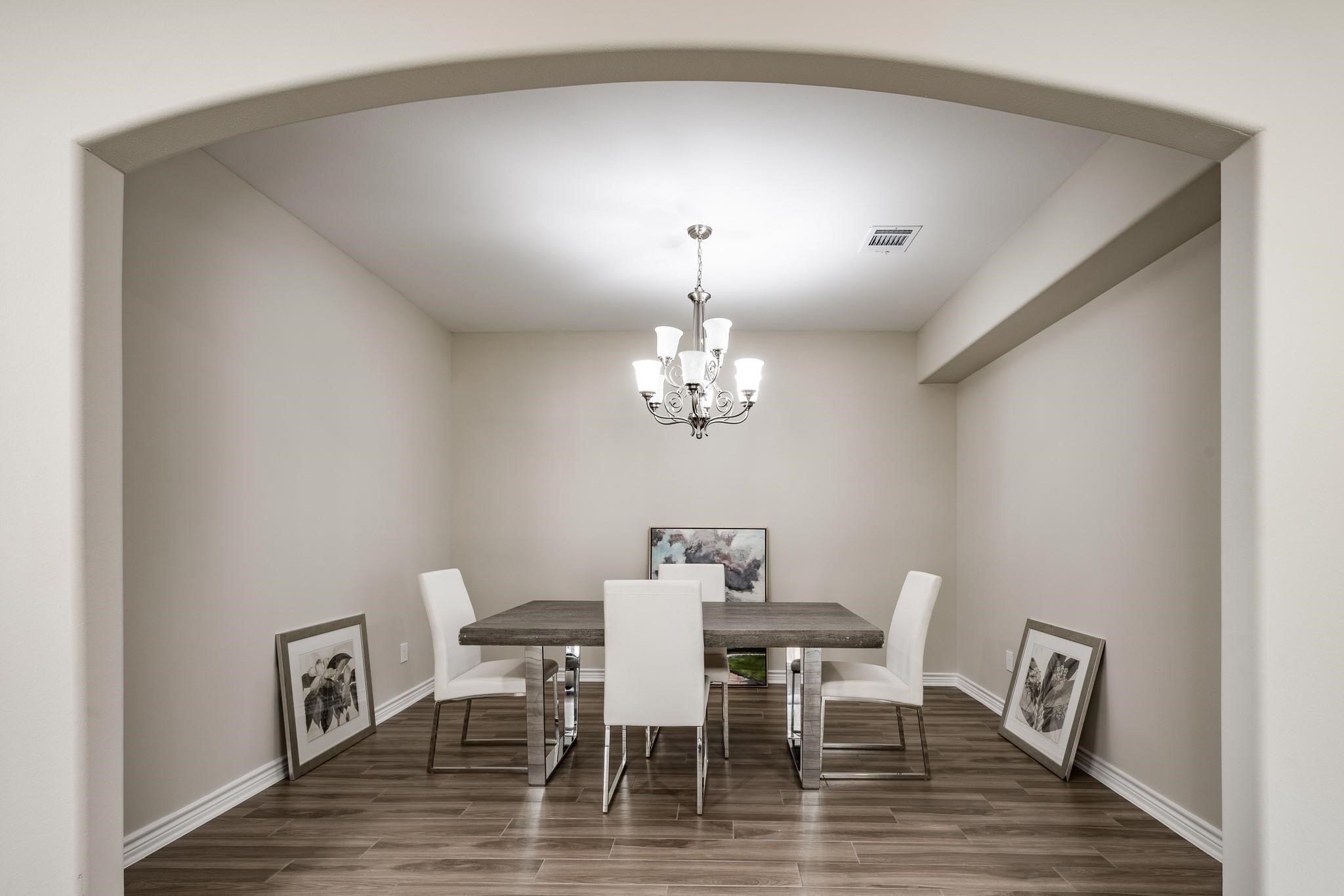10610 Ellerston Road Cleveland, TX 77327 - Photo 7 of 26 a view of a dining room with furniture and chandelier