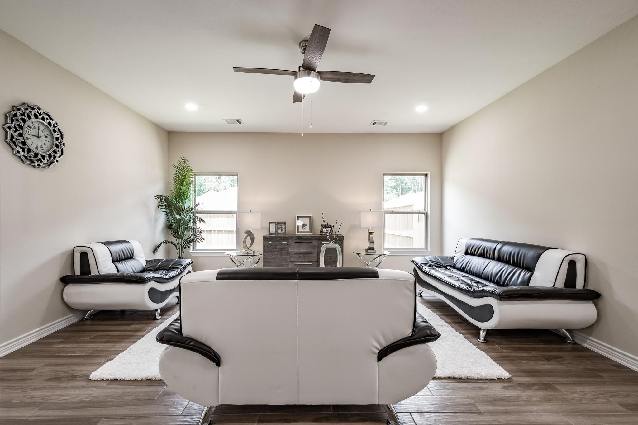 10610 Ellerston Road Cleveland, TX 77327 - Photo 10 of 26 a living room with furniture and a wooden floor