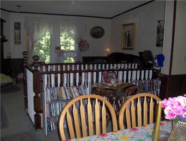 1636 Simmons Ridge Road Cornersville, TN 37047 - Photo 2 of 15 View of Living Room from Dining Room. Notice the separating stairwell leading to the basement living area.