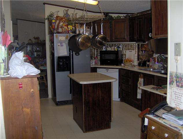 1636 Simmons Ridge Road Cornersville, TN 37047 - Photo 5 of 15 Kitchen has lots of cabinets, island, pantry, desk area and upgraded stainless refrigerator, stove and ventless hood.