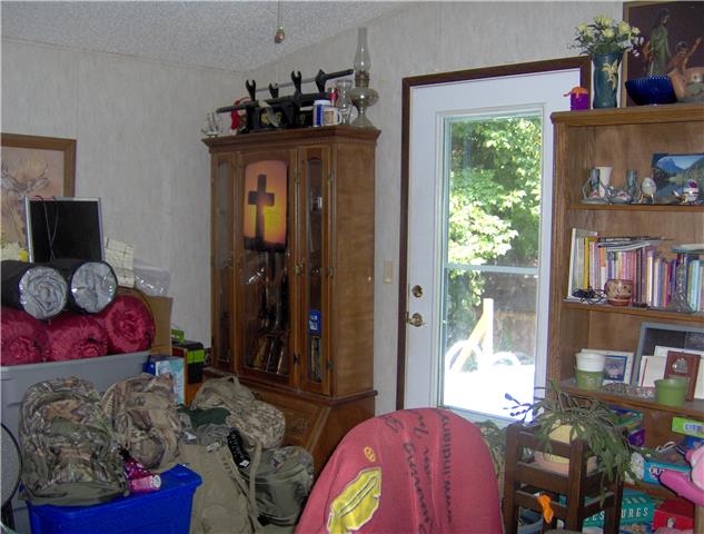 1636 Simmons Ridge Road Cornersville, TN 37047 - Photo 7 of 15 Second main level guest room, currently used as an office, has door leading to decked pool.