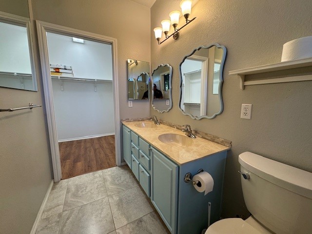 275 Bonham Loop Georgetown, TX 78633 - Photo 13 of 25 a bathroom with a toilet sink and mirror