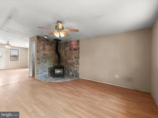 a very nice looking room with a fireplace and a chandelier