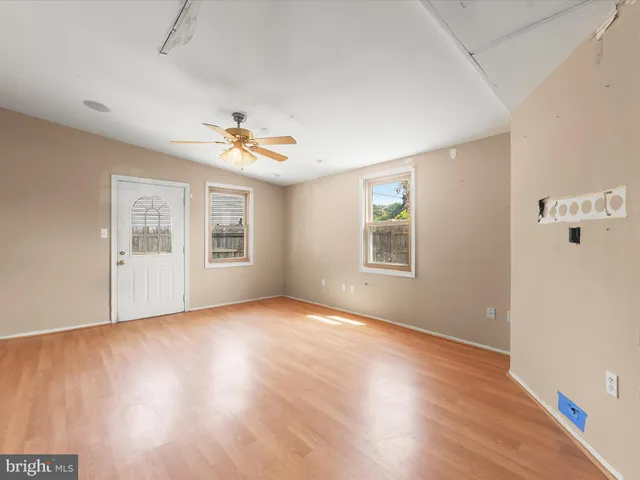 a view of an empty room with windows