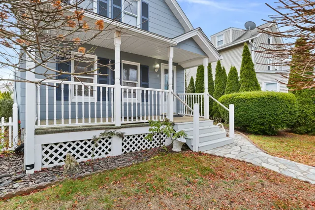 a view of a brick house with a large window