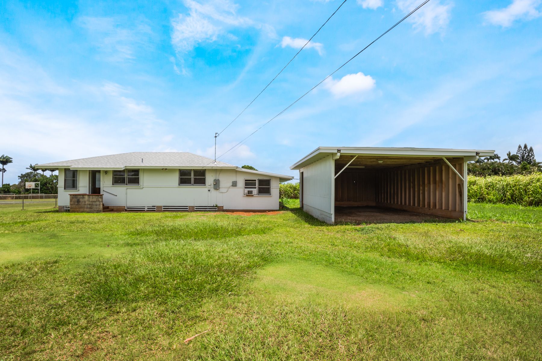 6151 Kawaihau Road Kapaa, HI 96746 - Photo 1 of 30 a front view of a house with a garden
