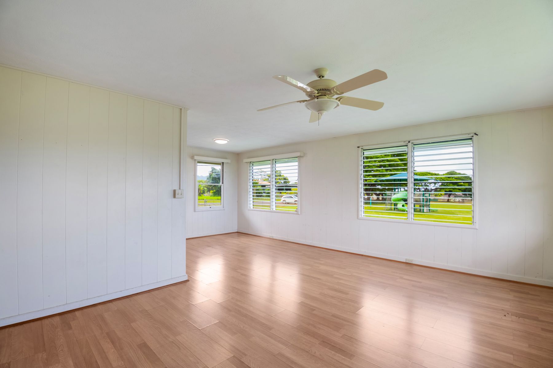 6151 Kawaihau Road Kapaa, HI 96746 - Photo 14 of 30 a view of an empty room with a window and wooden floor