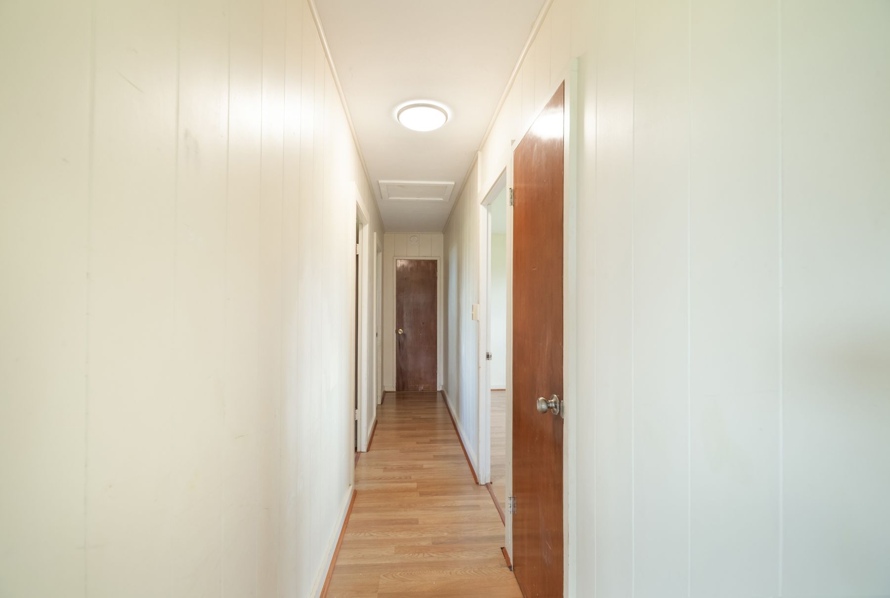 6151 Kawaihau Road Kapaa, HI 96746 - Photo 19 of 30 a view of a hallway with wooden floor