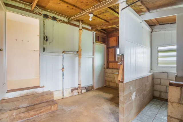 a white toilet sitting next to a window