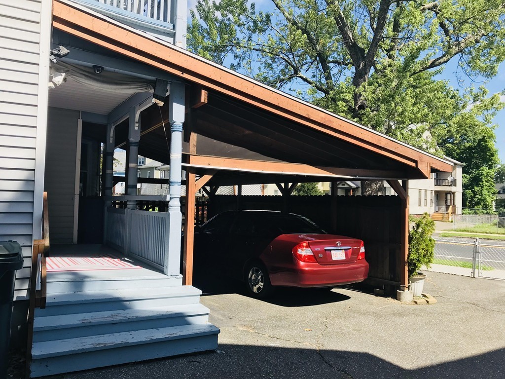 99 Hall Street Springfield, MA 01108 - Photo 3 of 10 a front view of a house with a garage