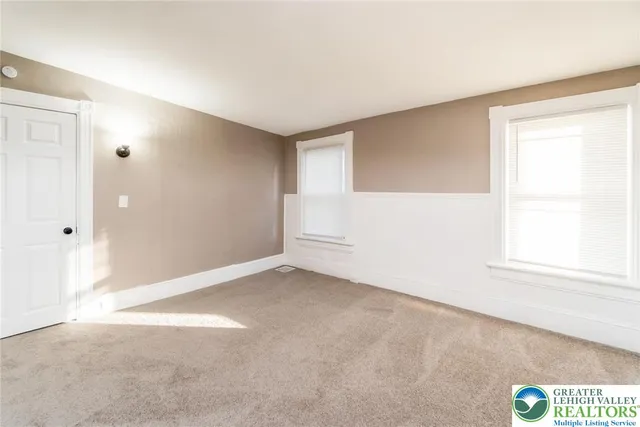 an empty room with windows