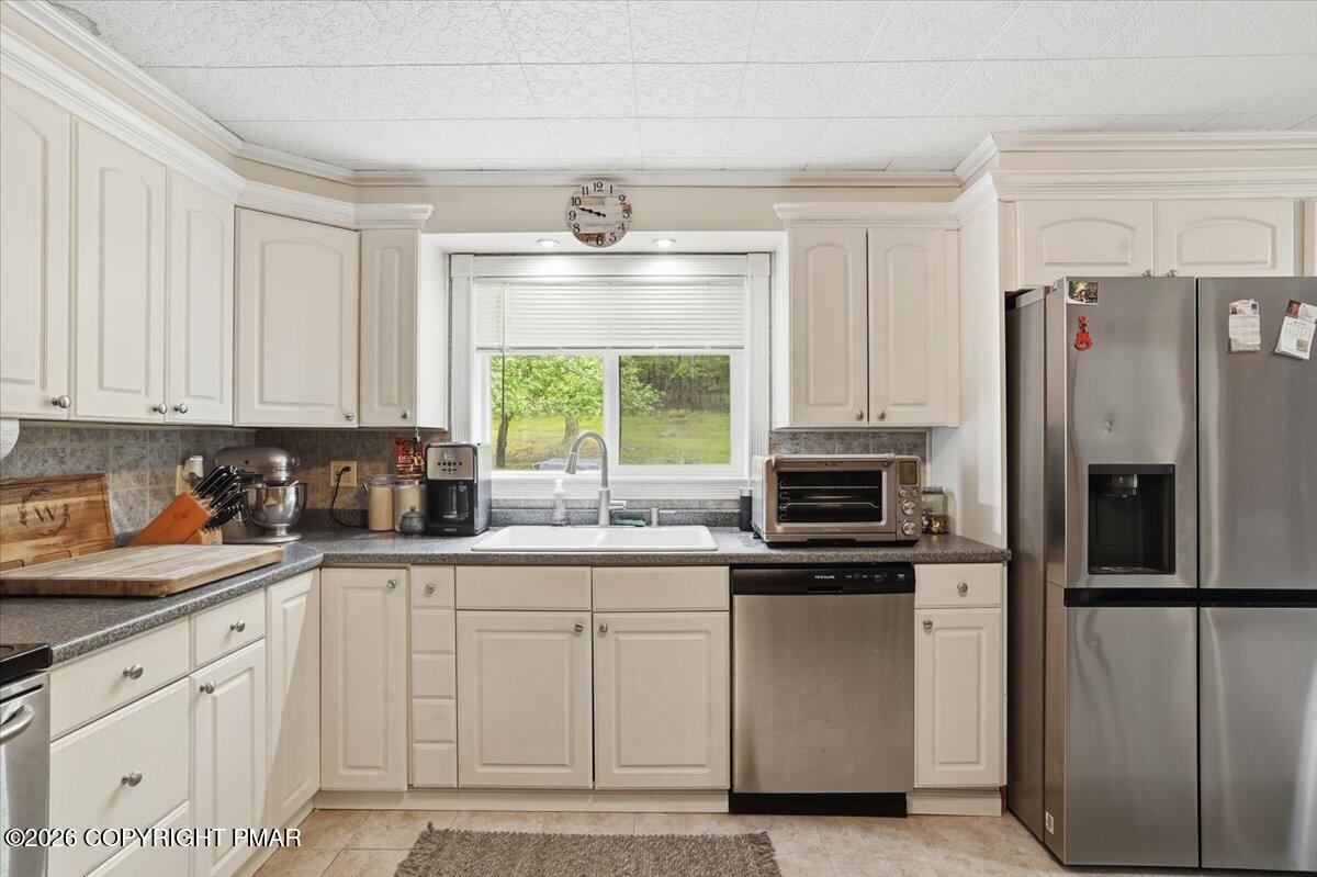 232 Garrity Road Hawley, PA 18428 - Photo 26 of 57 a kitchen with white cabinets and stainless steel appliances