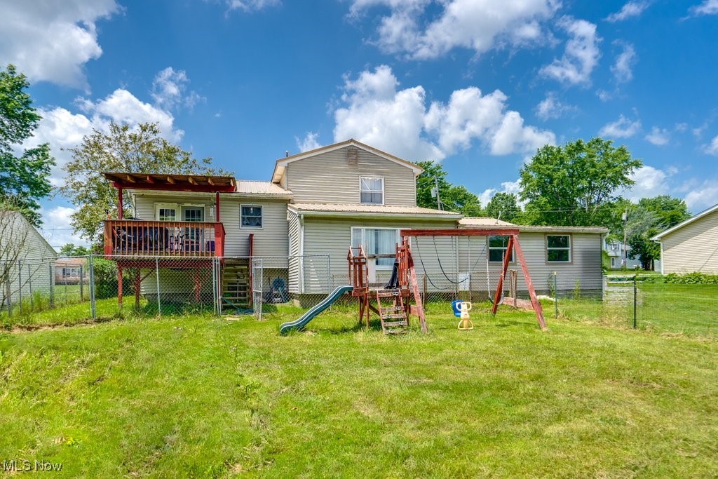 8998 Horn Road Windham, OH 44288 - Photo 5 of 34 Rear view of house with a playground and a wooden deck