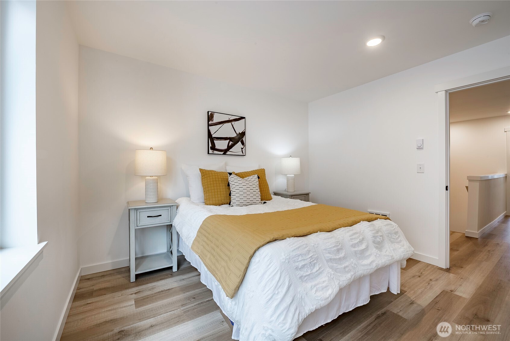 2999 Cedar View Road Blaine, WA 98230 - Photo 23 of 37 a bedroom with a bed and painting on the wall