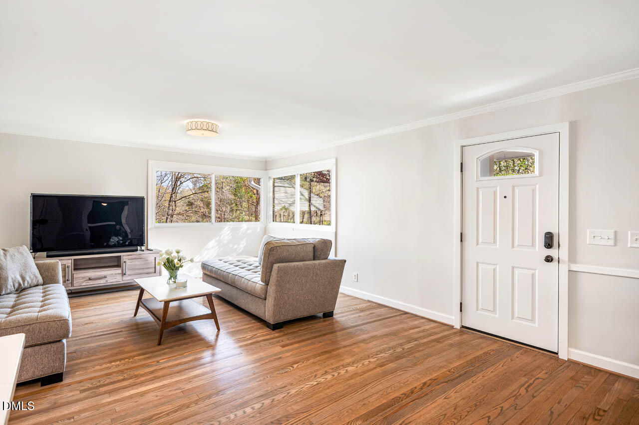 231 Flemington Road Chapel Hill, NC 27517 - Photo 9 of 48 a living room with furniture and a flat screen tv