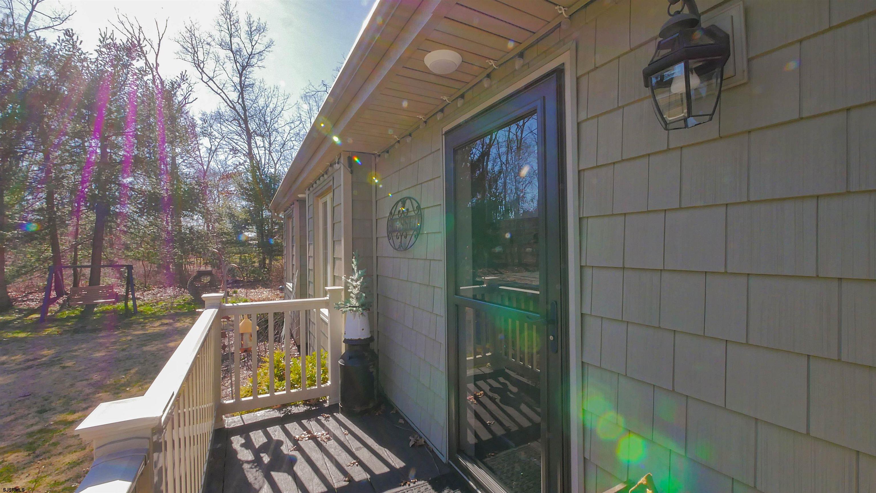 337 Broad Street Milmay, NJ 08330 - Photo 12 of 36 a view of balcony with wooden floor