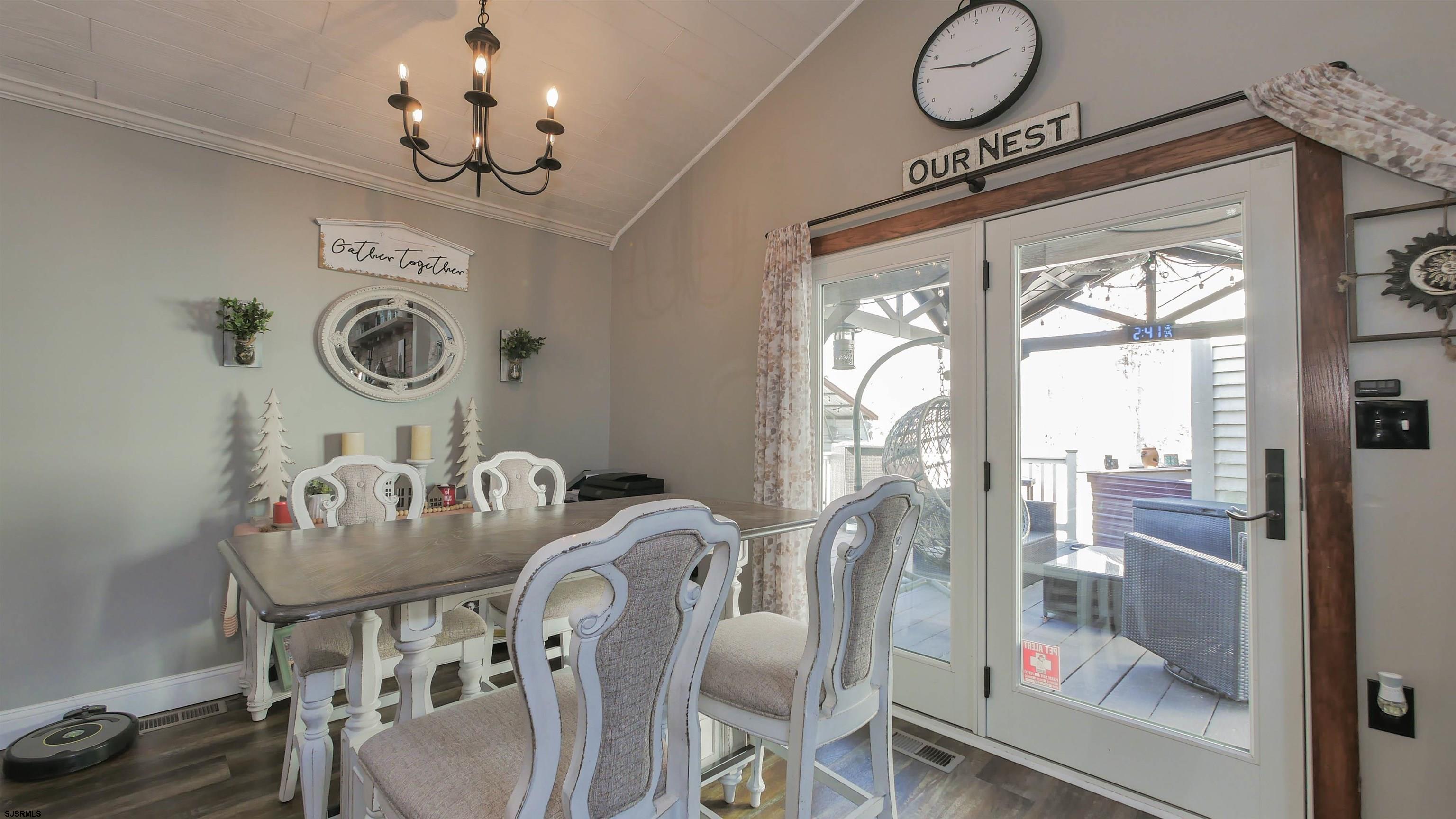 337 Broad Street Milmay, NJ 08330 - Photo 22 of 36 a view of a dining room with furniture wooden floor and chandelier