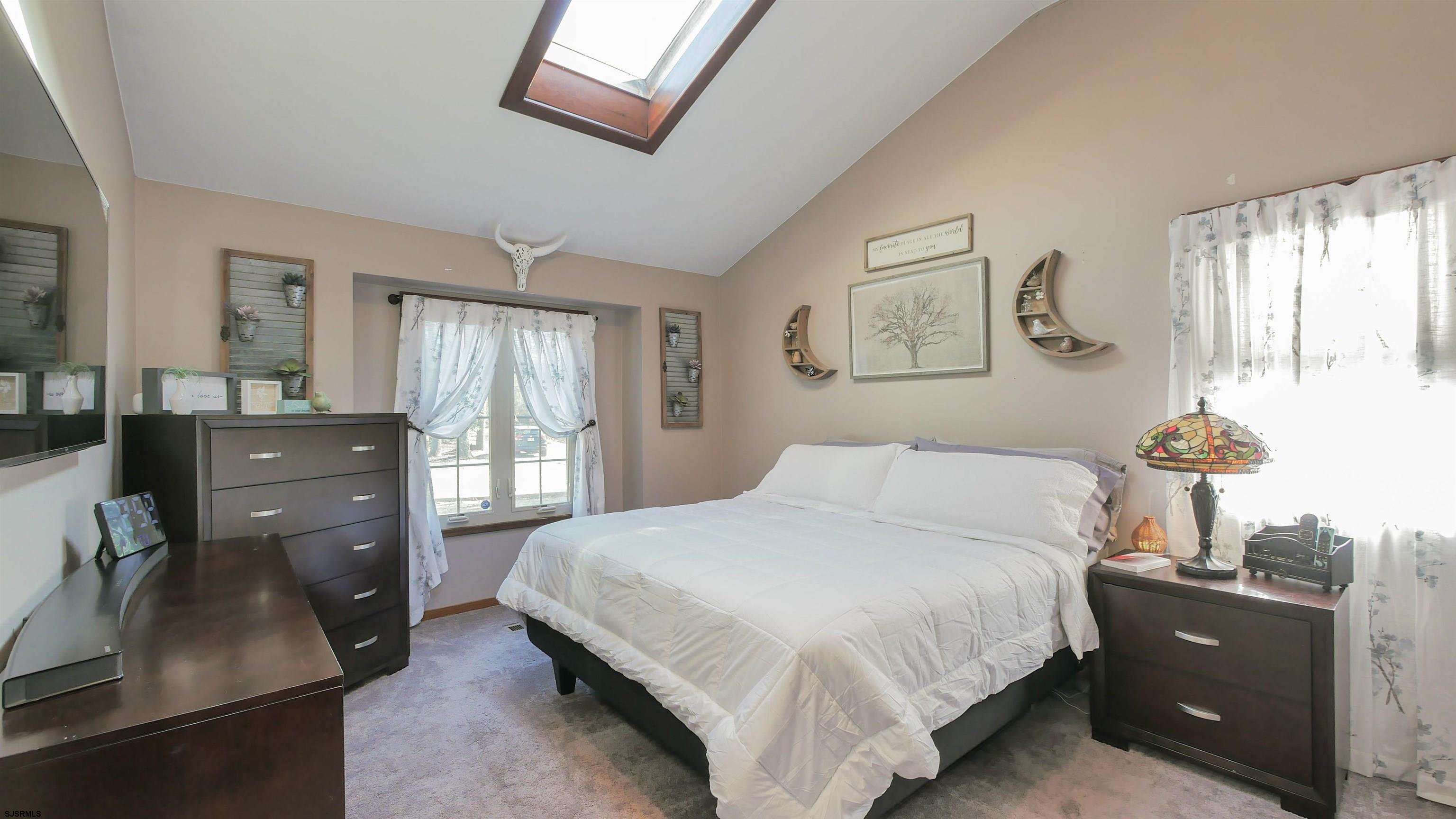 337 Broad Street Milmay, NJ 08330 - Photo 24 of 36 a bedroom with a bed and wooden floor