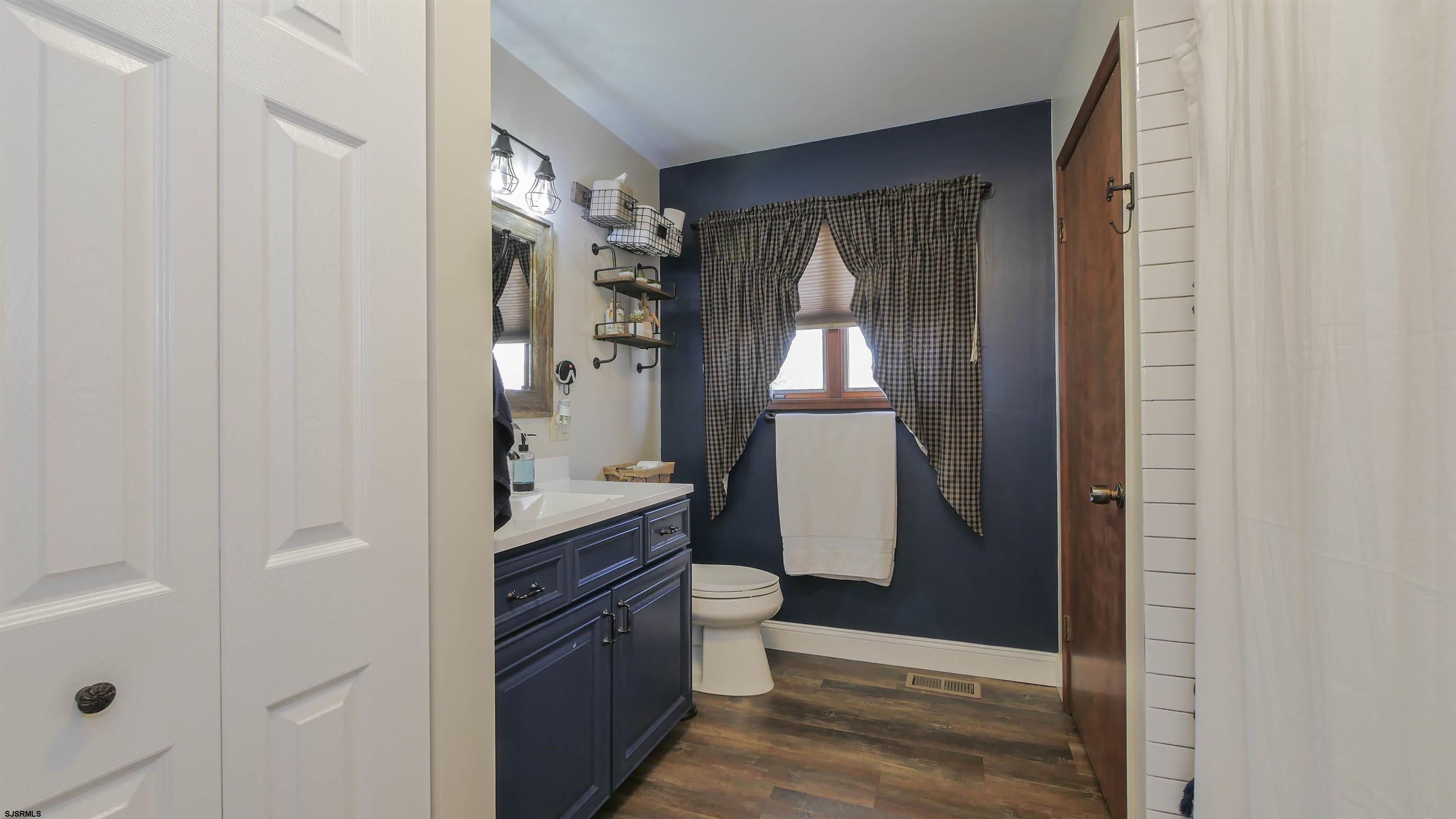 337 Broad Street Milmay, NJ 08330 - Photo 29 of 36 a bathroom with a bathtub and a shower