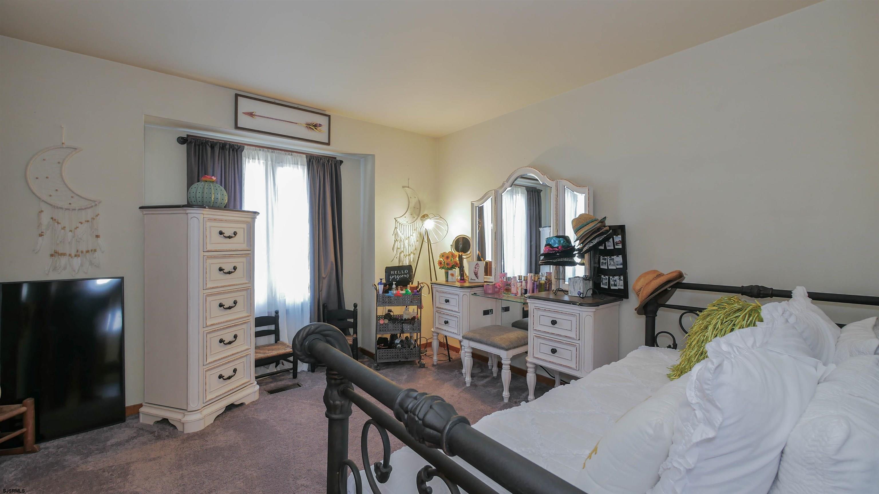 337 Broad Street Milmay, NJ 08330 - Photo 33 of 36 a living room with furniture and a flat screen tv