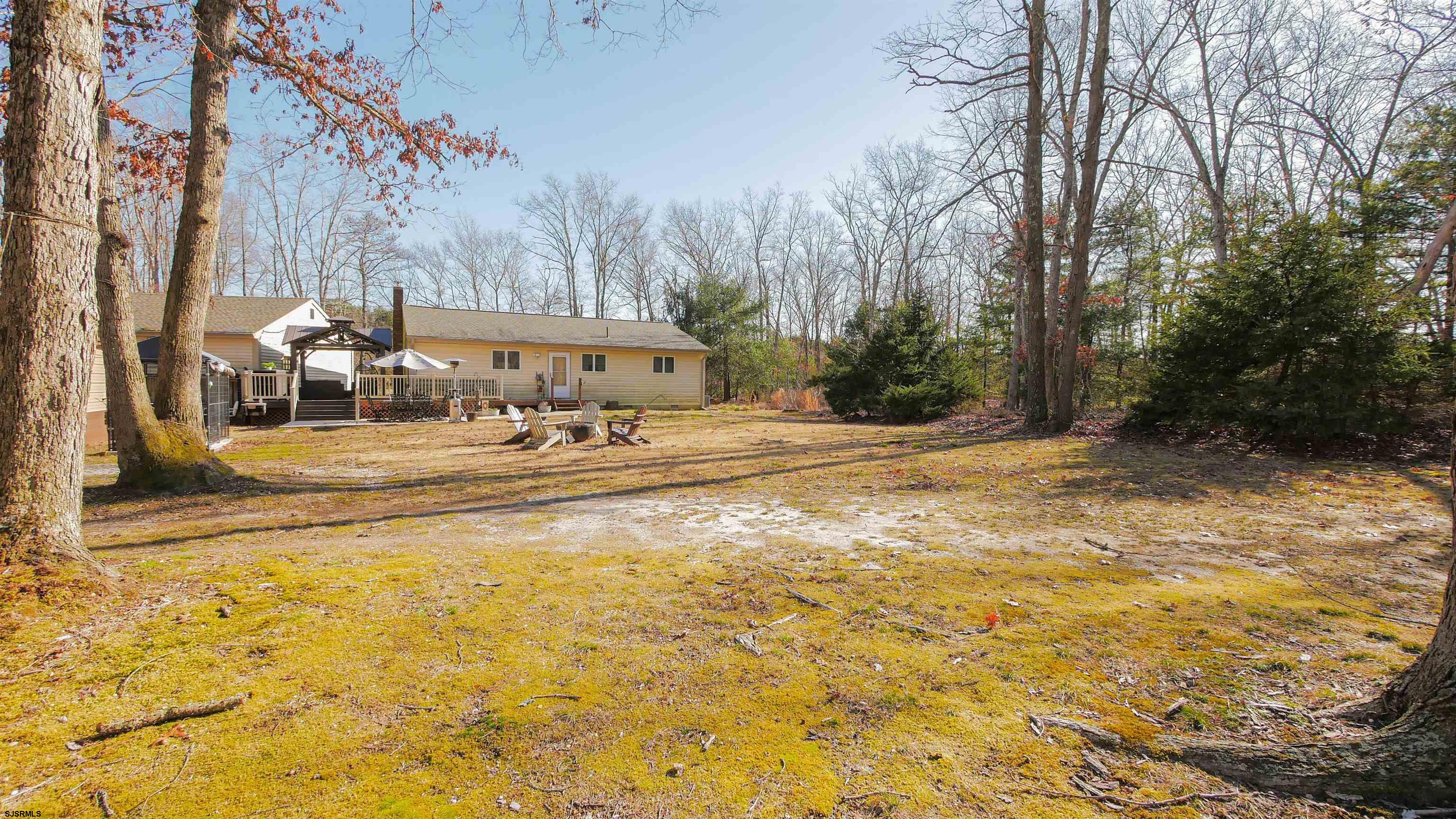 337 Broad Street Milmay, NJ 08330 - Photo 6 of 36 a backyard of a house with trees and outdoor space
