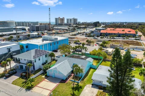 an aerial view of a house with a swimming pool