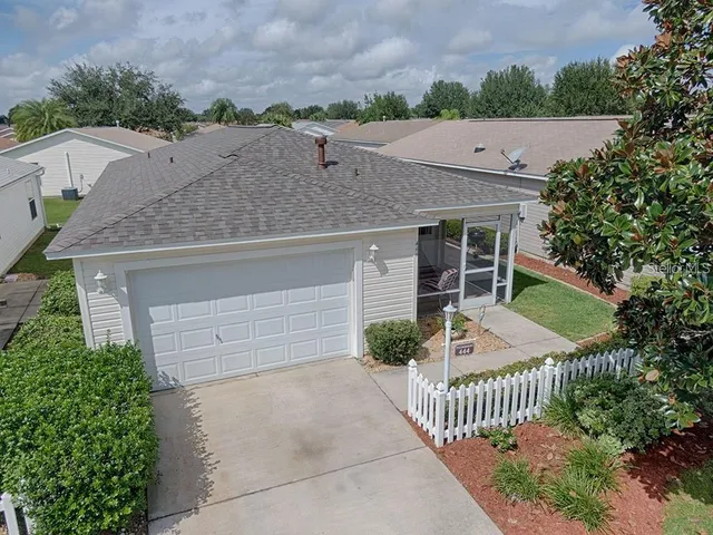an aerial view of a houses with an outdoor space