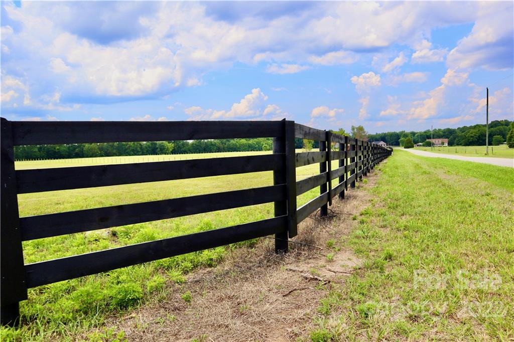 1663 Mayhugh Road, Unit 2 Chester, SC 29706 - Photo 3 of 6 a view of a yard with wooden fence
