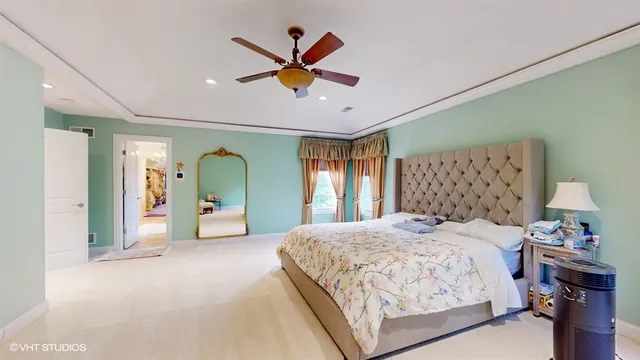 a living room with patio furniture and a chandelier