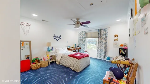 a bathroom with a granite countertop double vanity sink and a mirror