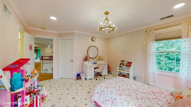 a living room with furniture and view of kitchen
