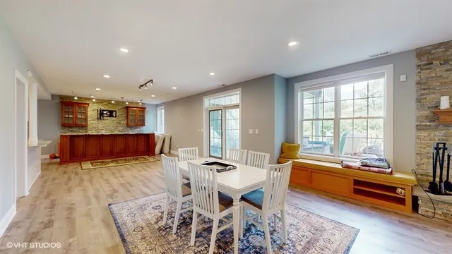 a view of kitchen and dining room with wooden floor