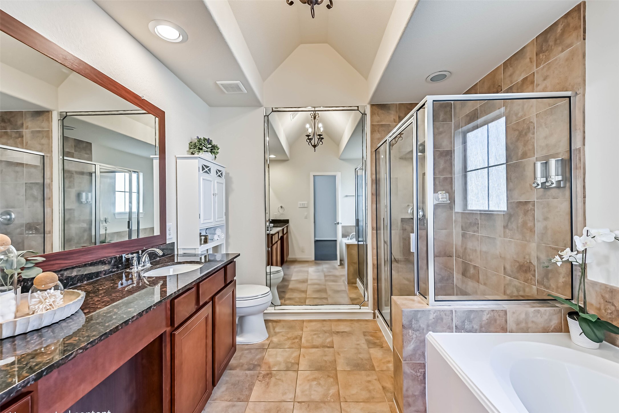 3208 Clearview Circle Houston, TX 77025 - Photo 20 of 30 A soaking tub and separate glass-enclosed shower add comfort to the en suite.