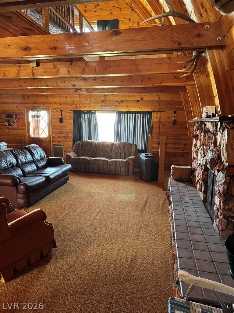 20996 Pinion Pine Road Pioche, NV 89043 - Photo 8 of 19 This inviting living space features warm wood paneling, exposed beams, and a cozy fireplace area.