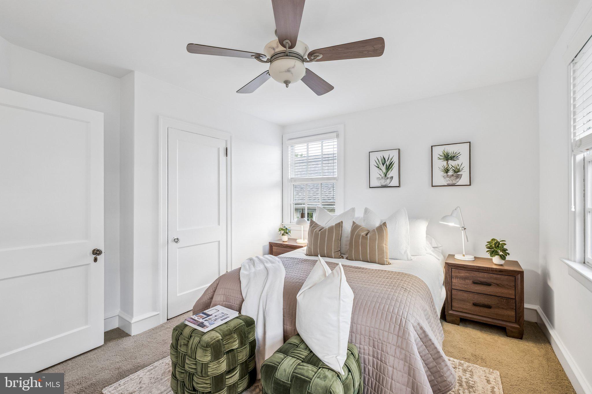 9 Doyle Road Wayne, PA 19087 - Photo 25 of 33 a bed room with a bed and a chandelier