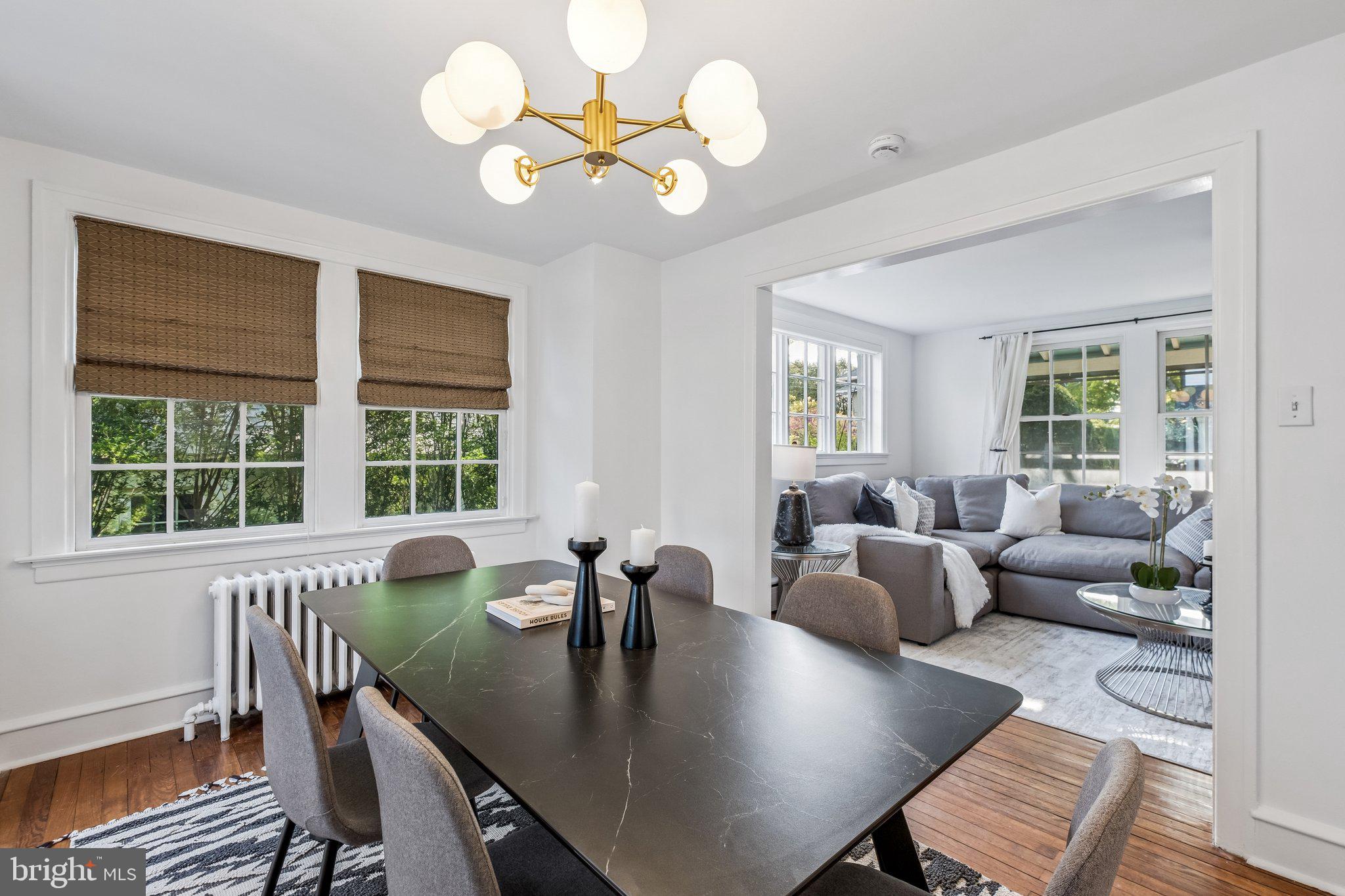 9 Doyle Road Wayne, PA 19087 - Photo 7 of 33 a view of a dining room with furniture a chandelier and wooden floor