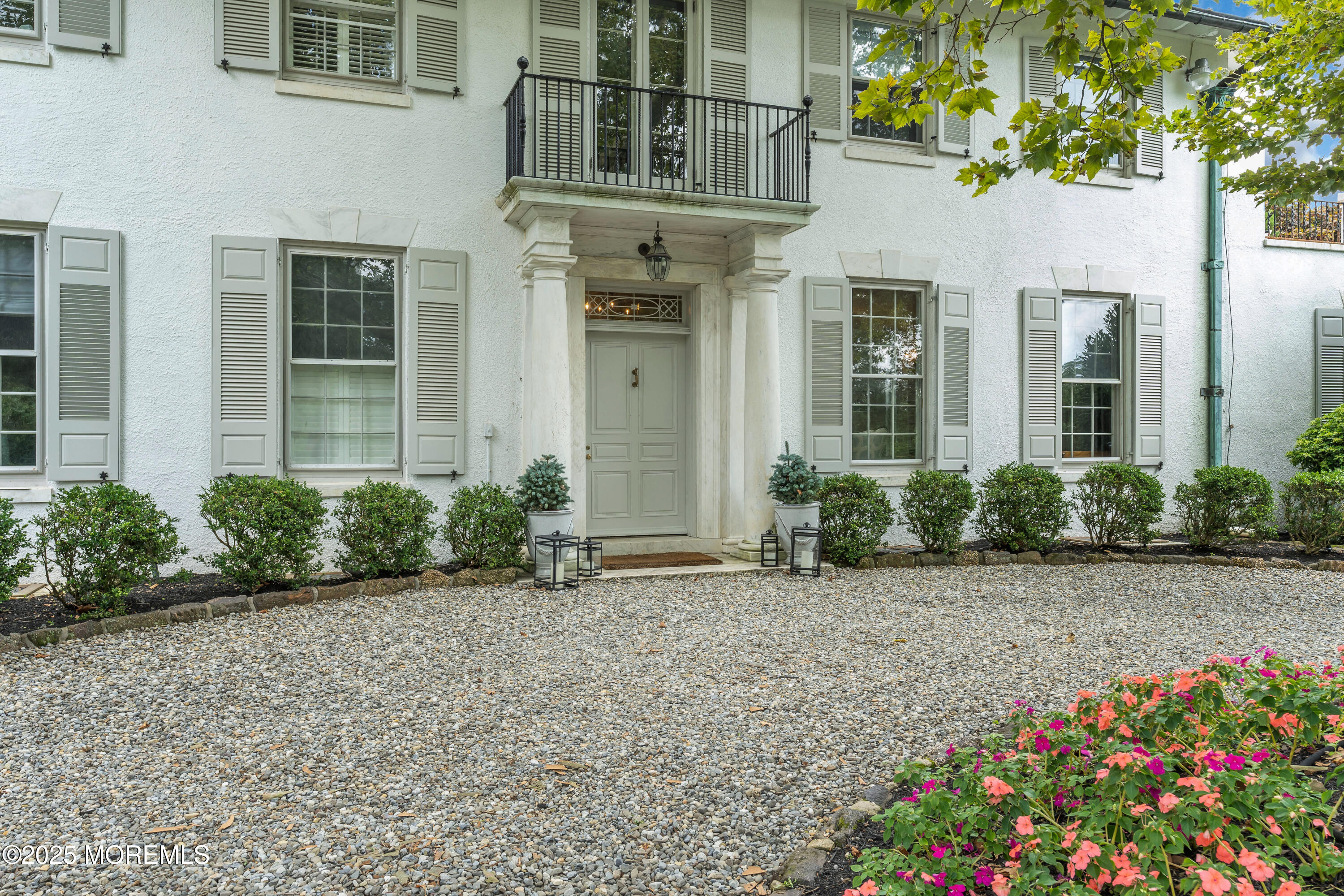809 Navesink River Road Rumson, NJ 07760 - Photo 12 of 45 front view of a brick house with a yard