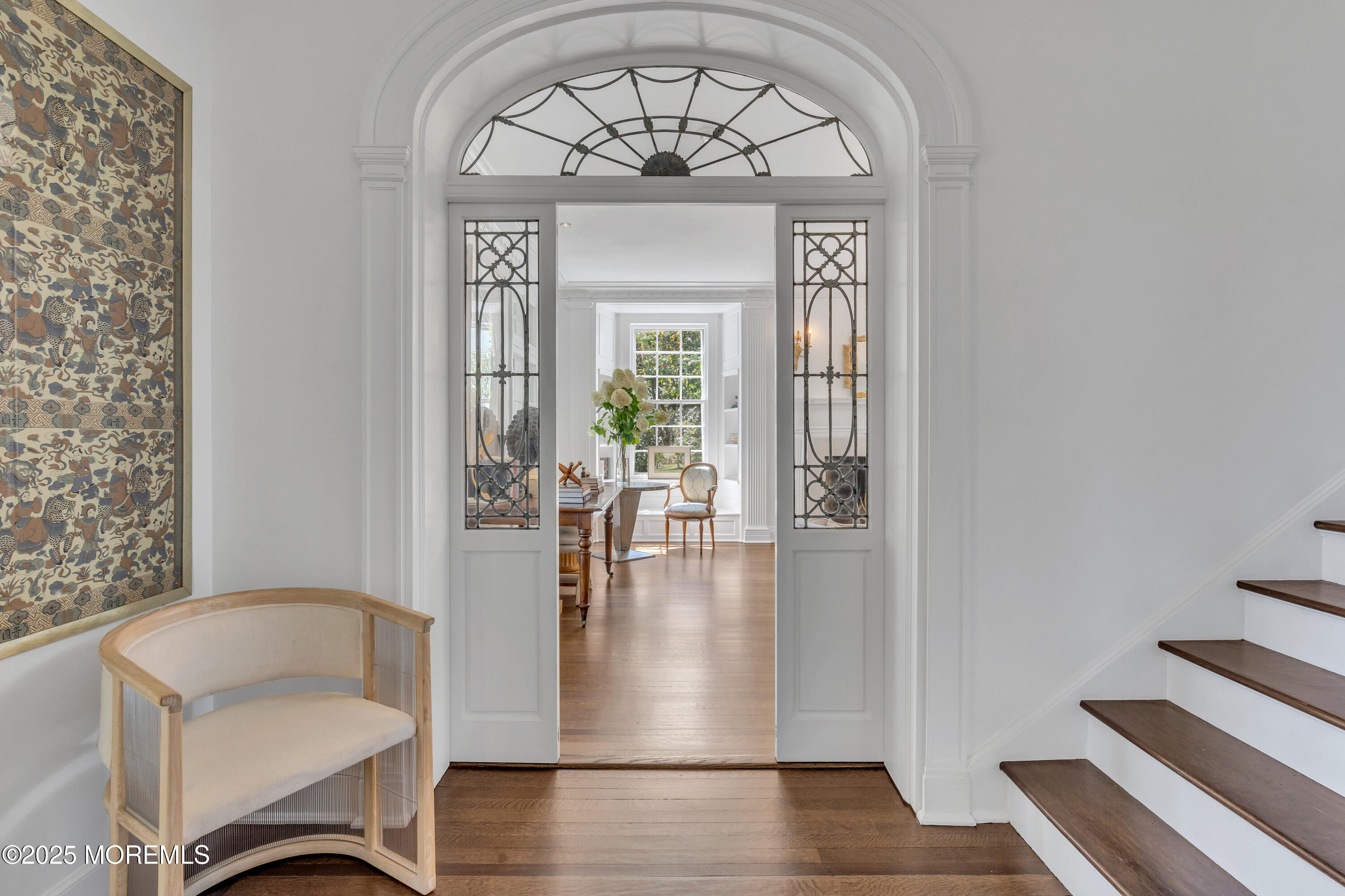 809 Navesink River Road Rumson, NJ 07760 - Photo 13 of 45 a view of a hallway with wooden floor and a dining room