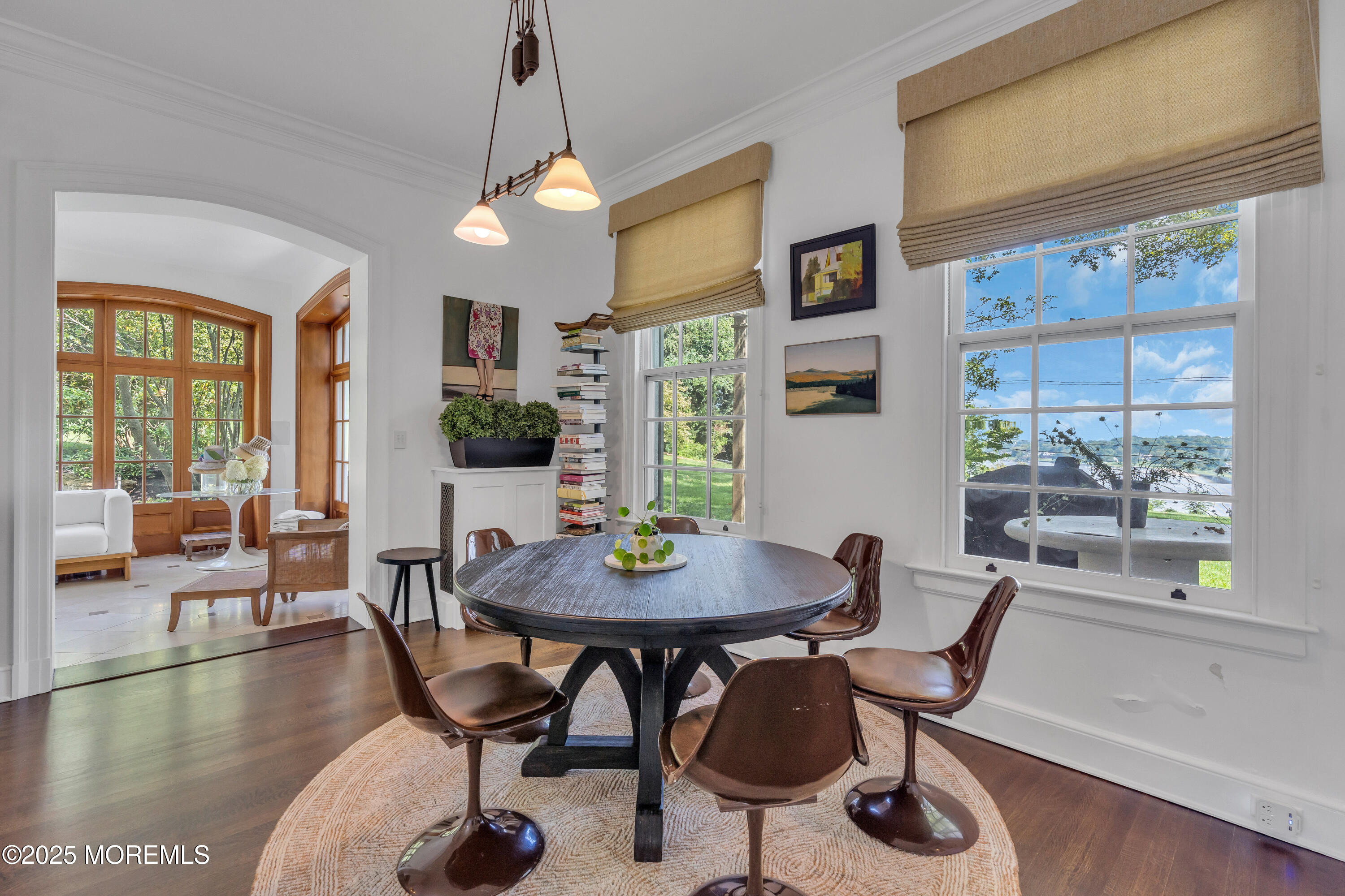 809 Navesink River Road Rumson, NJ 07760 - Photo 17 of 45 a view of a dining room with furniture window and wooden floor
