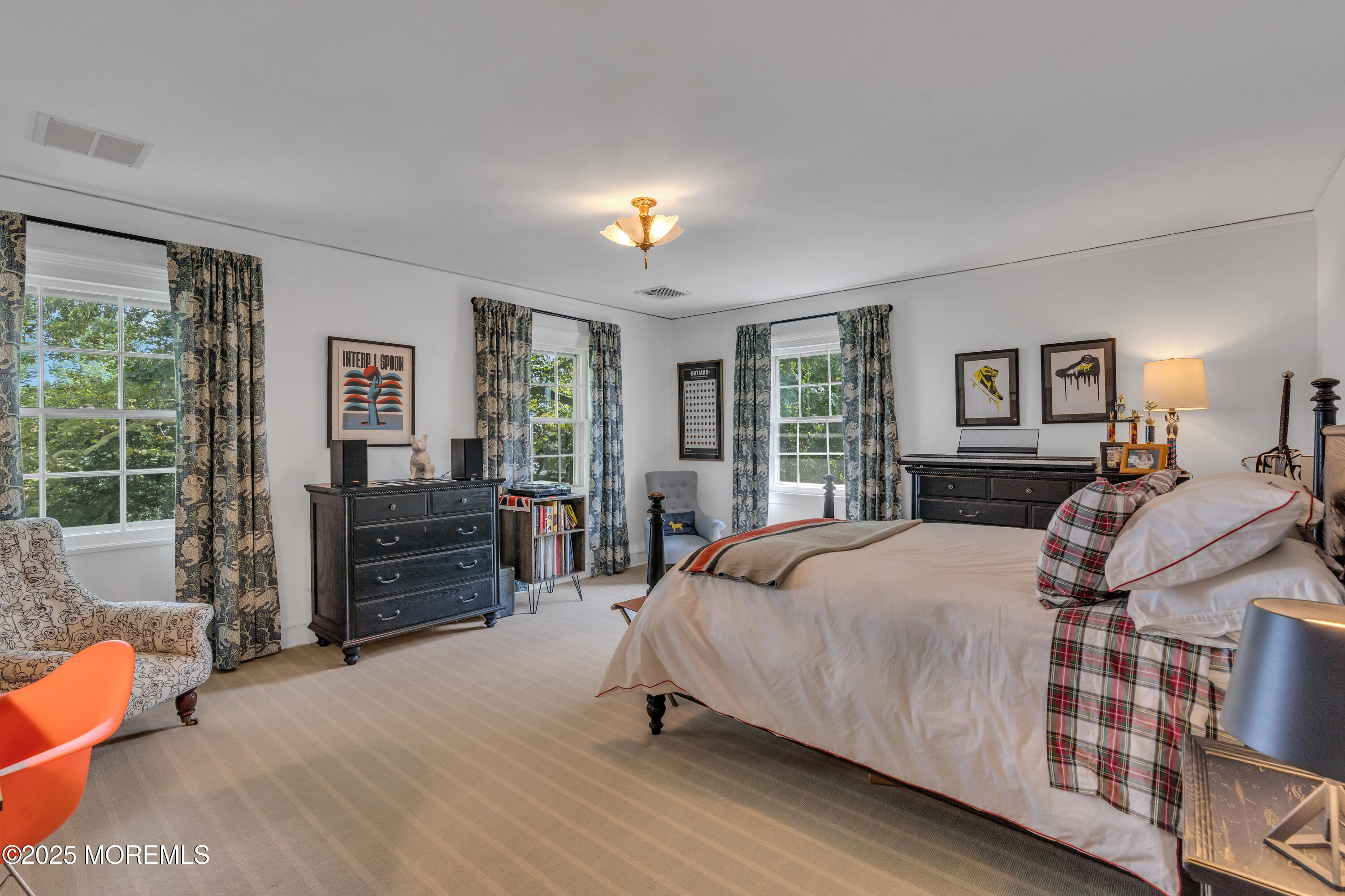 809 Navesink River Road Rumson, NJ 07760 - Photo 22 of 45 a bedroom with a bed and wooden floor