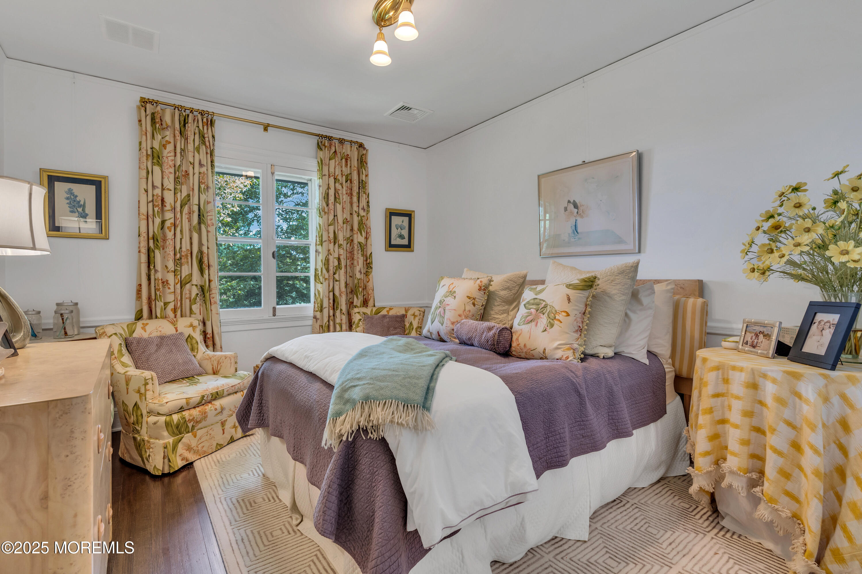 809 Navesink River Road Rumson, NJ 07760 - Photo 25 of 45 a bedroom with a bed and wooden floor